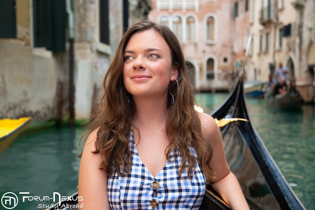 student-on-canal-boat-in-venice